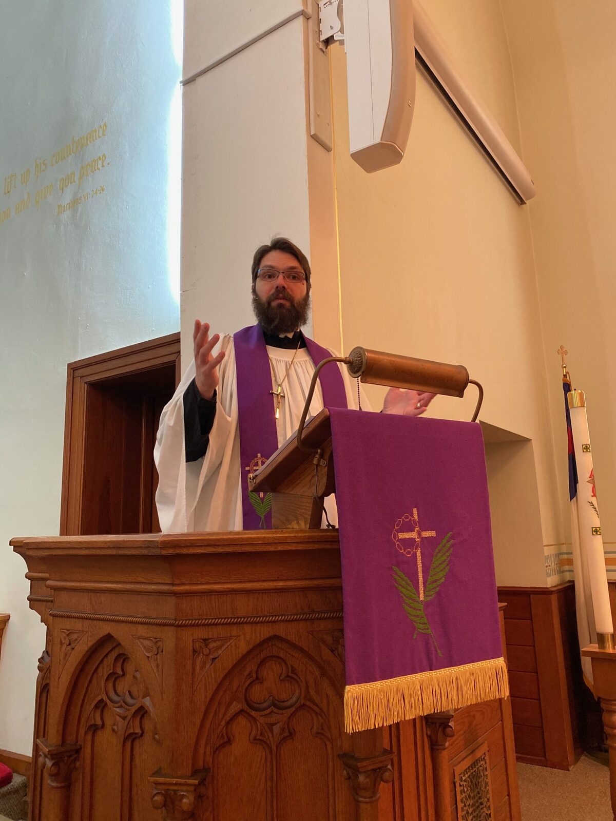 Pastor Gillespie preaching from the pulpit during Lent