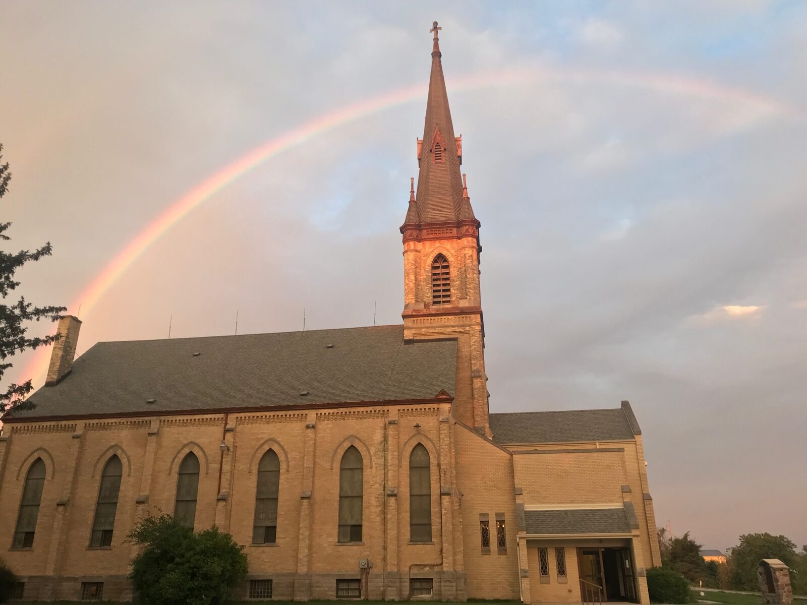 Rainbow over the St. John steeple, Sherman Center
